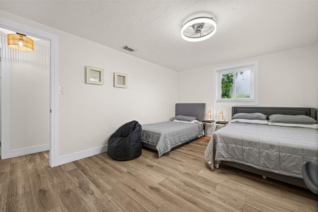 219 Coral Road Venice, FL 34293 - Photo 17 of 24 a bedroom with a bed and a window
