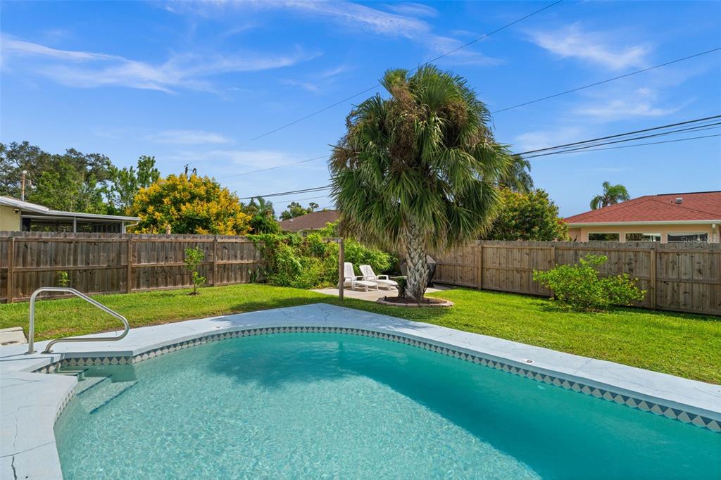 219 Coral Road Venice, FL 34293 - Photo 23 of 24 a view of a backyard with swimming pool