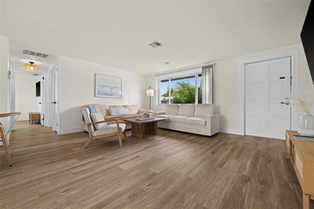 219 Coral Road Venice, FL 34293 - Photo 4 of 24 a living room with furniture and wooden floor