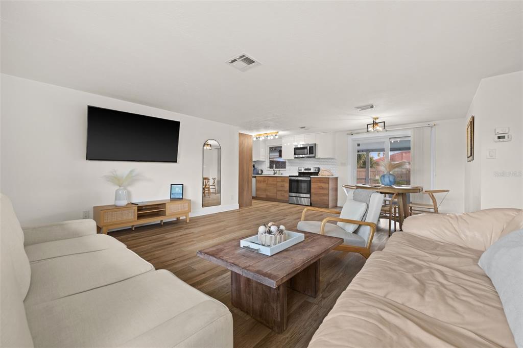 219 Coral Road Venice, FL 34293 - Photo 6 of 24 a living room with furniture and a flat screen tv