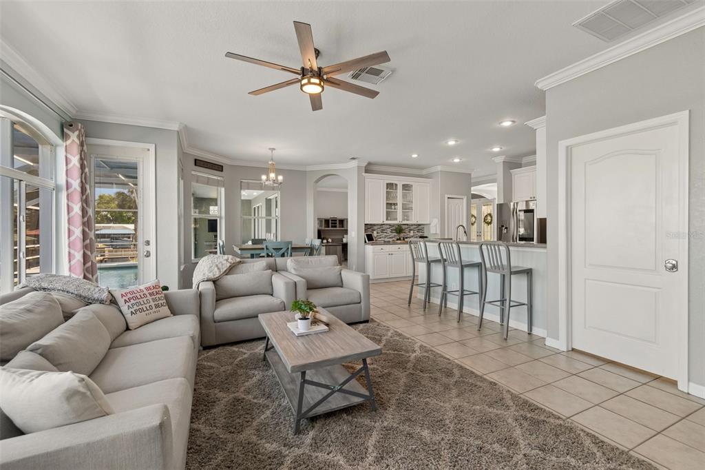 703 Bunker View Drive Apollo Beach, FL 33572 - Photo 16 of 49 a living room with furniture and a view of kitchen