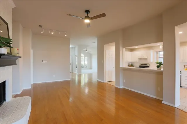 a view of a kitchen with a sink and a refrigerator