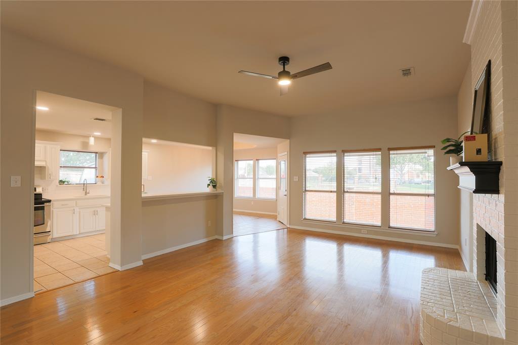 3616 Sutter Court Fort Worth, TX 76137 - Photo 18 of 28 a view of an empty room with wooden floor and a window
