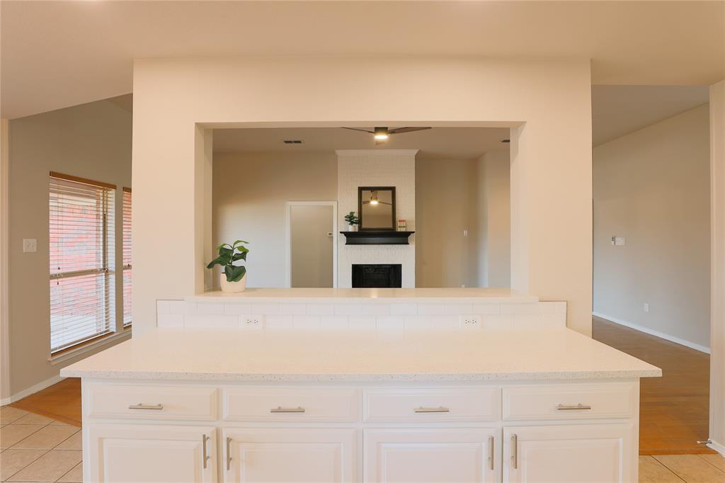 3616 Sutter Court Fort Worth, TX 76137 - Photo 19 of 28 a view of a kitchen with a sink and dishwasher