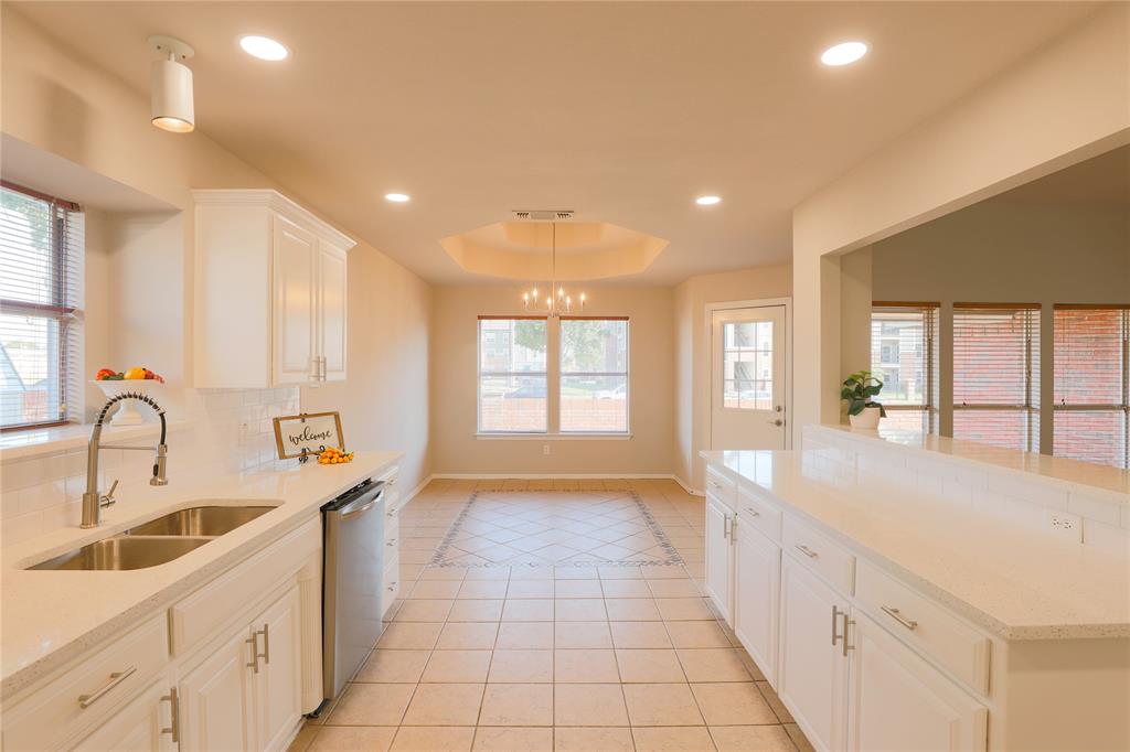 3616 Sutter Court Fort Worth, TX 76137 - Photo 20 of 28 a view of a kitchen with a sink and windows