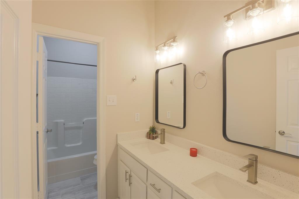 3616 Sutter Court Fort Worth, TX 76137 - Photo 25 of 28 a bathroom with a sink and a mirror