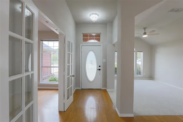 a view of entryway with wooden floor