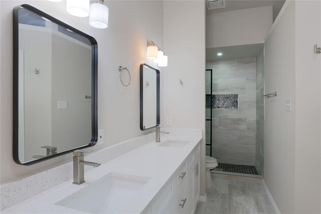 3616 Sutter Court Fort Worth, TX 76137 - Photo 7 of 28 a bathroom with a sink a toilet and shower