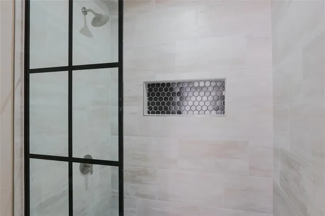 a large white kitchen with a sink and dishwasher a refrigerator with wooden floor