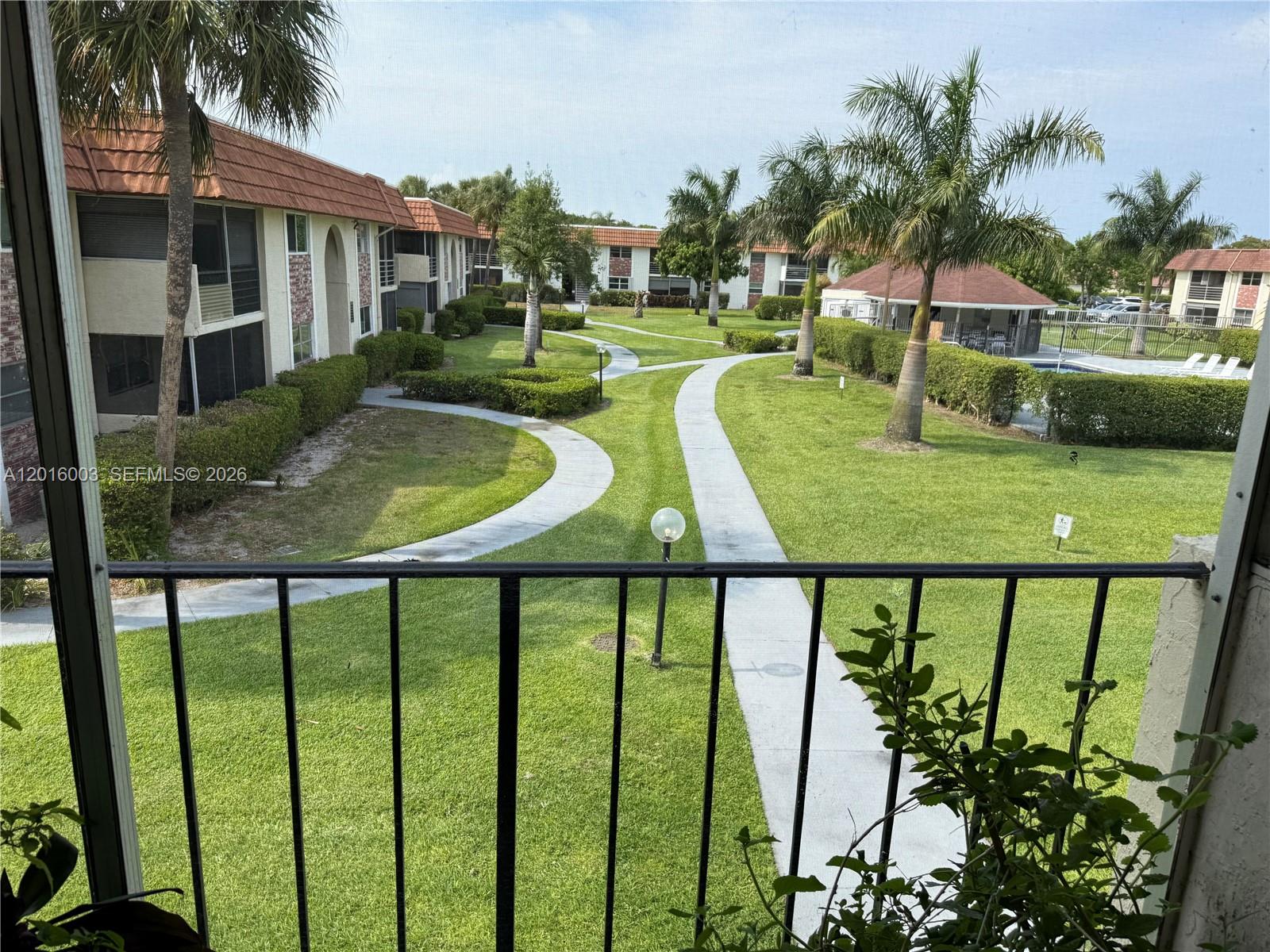 22805 Southwest 66th Avenue, Unit 208 Boca Raton, FL 33428 - Photo 14 of 28 a view of a patio with swimming pool and furniture