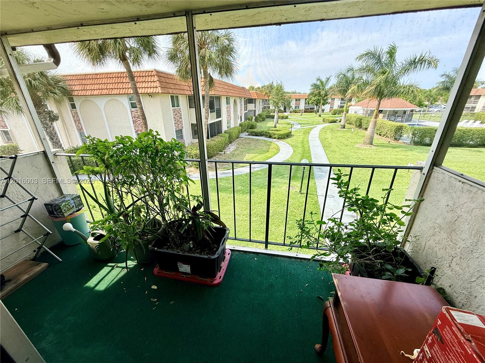 22805 Southwest 66th Avenue, Unit 208 Boca Raton, FL 33428 - Photo 15 of 28 a view of a porch with a furniture