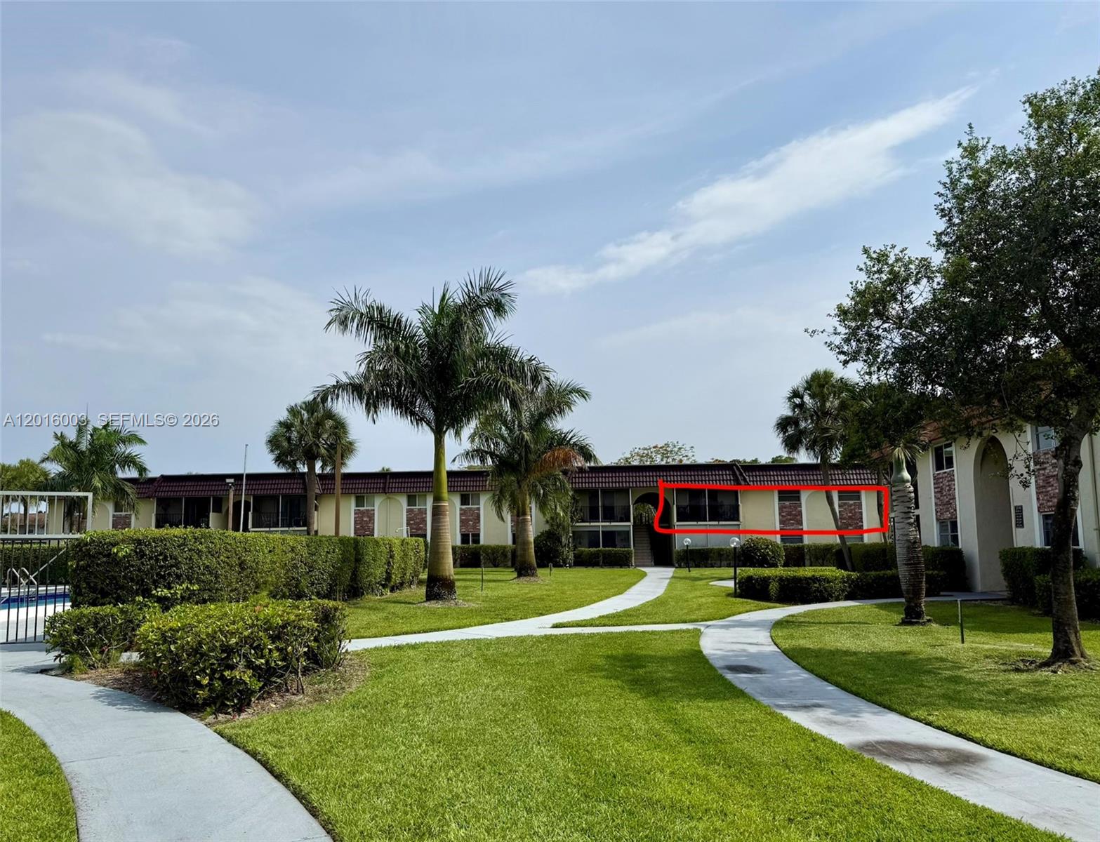 22805 Southwest 66th Avenue, Unit 208 Boca Raton, FL 33428 - Photo 2 of 28 a front view of house with yard and green space