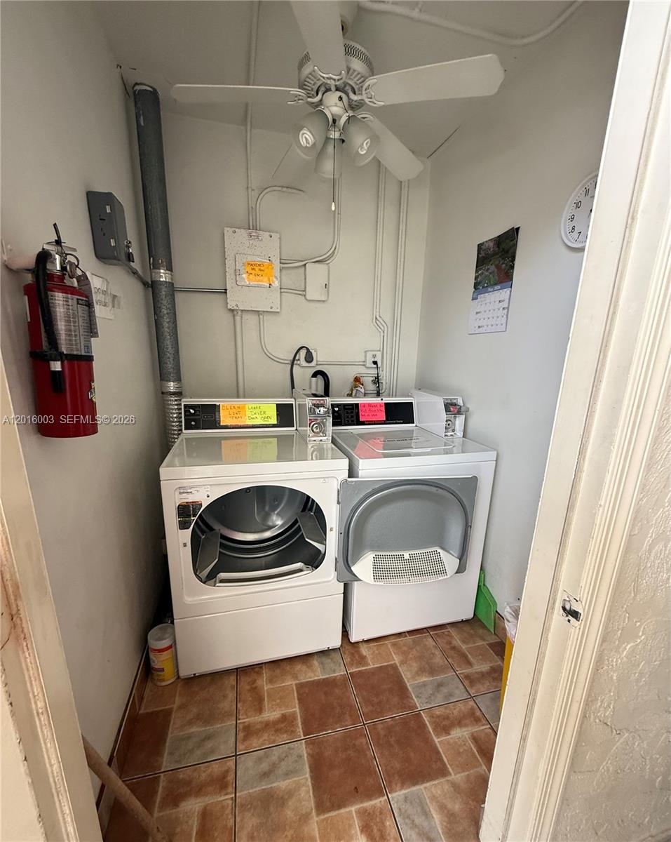 22805 Southwest 66th Avenue, Unit 208 Boca Raton, FL 33428 - Photo 23 of 28 a utility room with dryer and washer