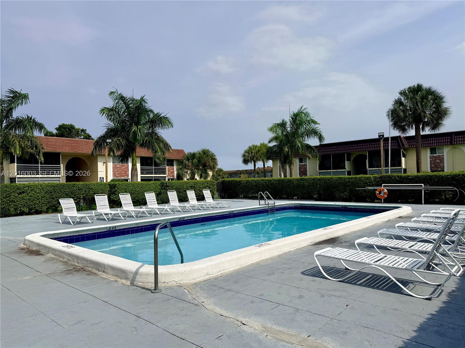 22805 Southwest 66th Avenue, Unit 208 Boca Raton, FL 33428 - Photo 3 of 28 a view of a house with a yard and sitting area