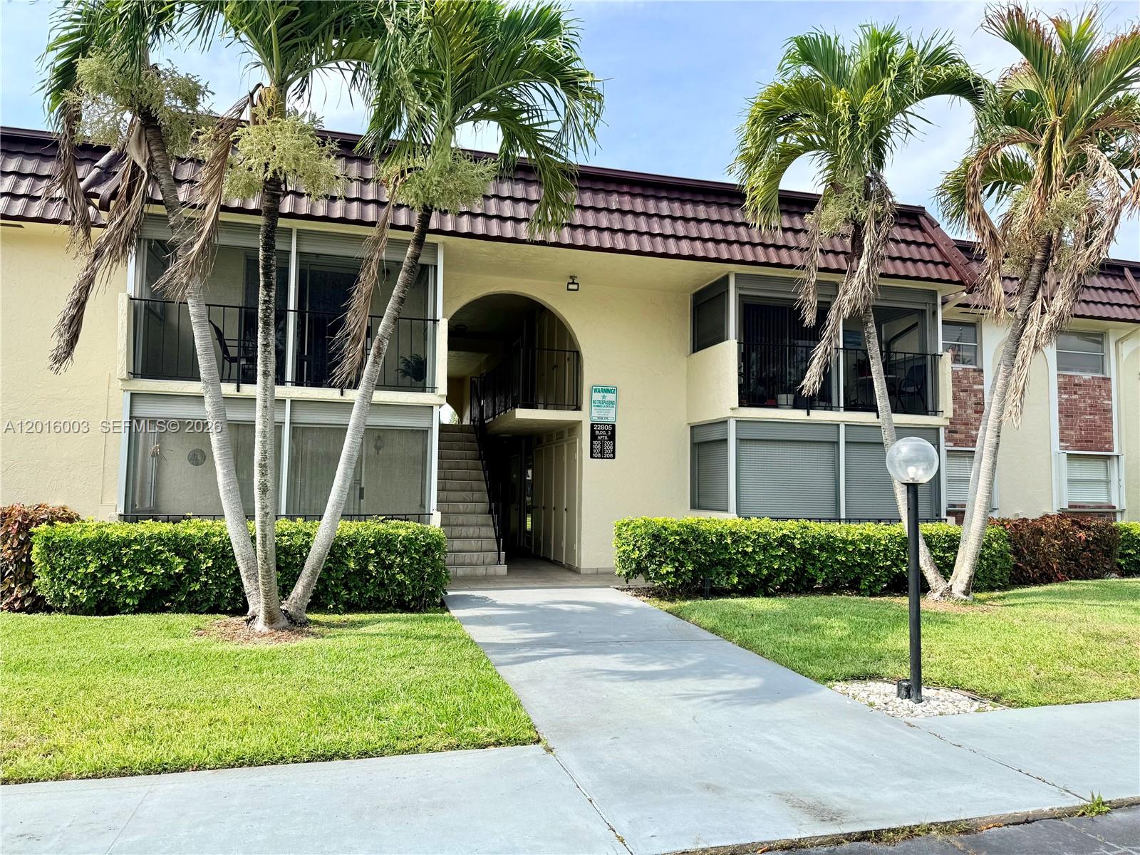 22805 Southwest 66th Avenue, Unit 208 Boca Raton, FL 33428 - Photo 10 of 28 a front view of a house with garden