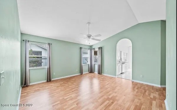 a view of a room with window and hallway