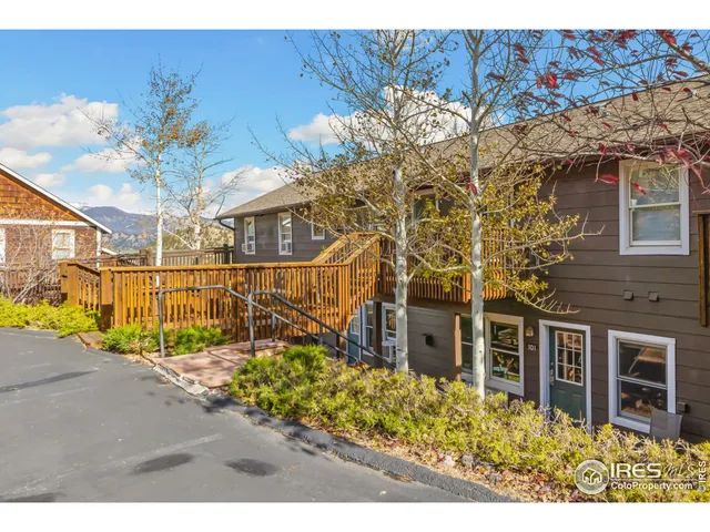 a view of a brick building next to a yard