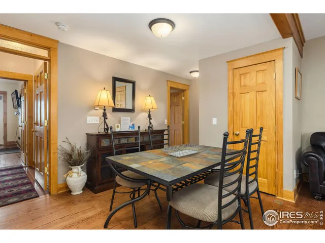 a view of a dining room with furniture and a chandelier