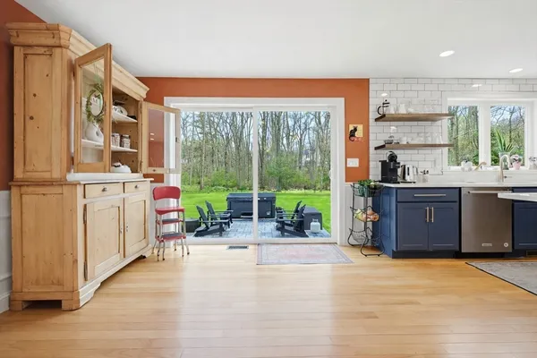 a view of a kitchen with a large window