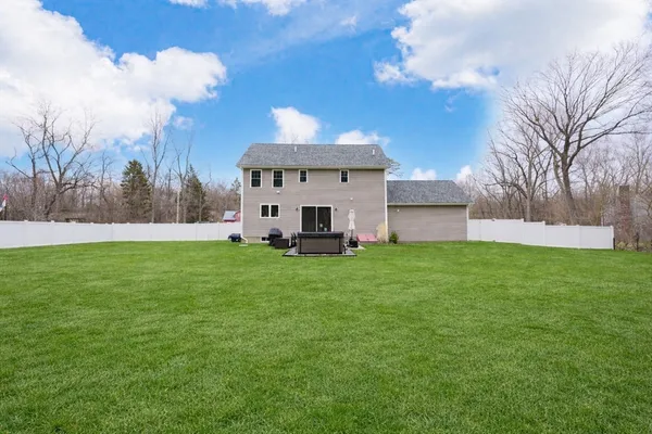 a view of a house with a back yard