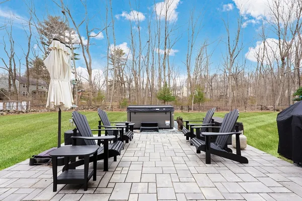 a view of a patio with table and chairs potted plants with wooden fence