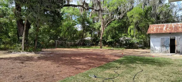 a fire hydrant in the middle of a field