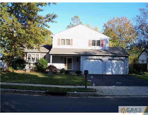 148 Howard Avenue Edison, NJ 08837 - Photo 1 of 19 a front view of a house with a yard