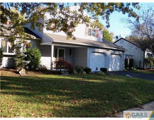 148 Howard Avenue Edison, NJ 08837 - Photo 2 of 19 a front view of house with yard and green space
