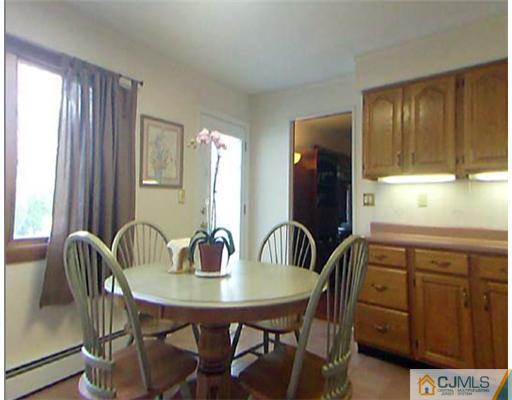 148 Howard Avenue Edison, NJ 08837 - Photo 11 of 19 a view of a dining room with furniture and window