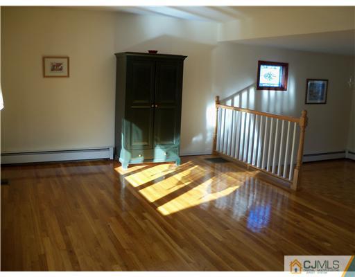 148 Howard Avenue Edison, NJ 08837 - Photo 3 of 19 a view of empty room with wooden floor