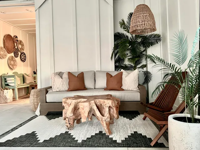 a living room with furniture and a floor to ceiling window