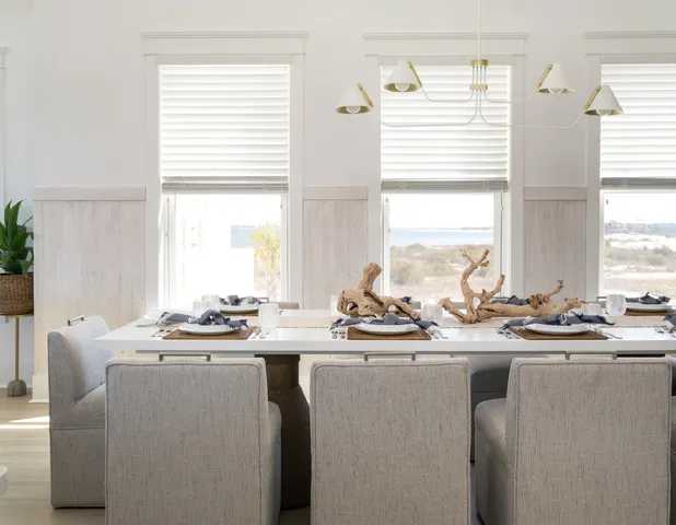 a bathroom with a sink a mirror and a potted plant