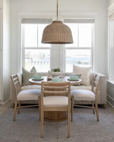 a bathroom with a toilet a sink and a window
