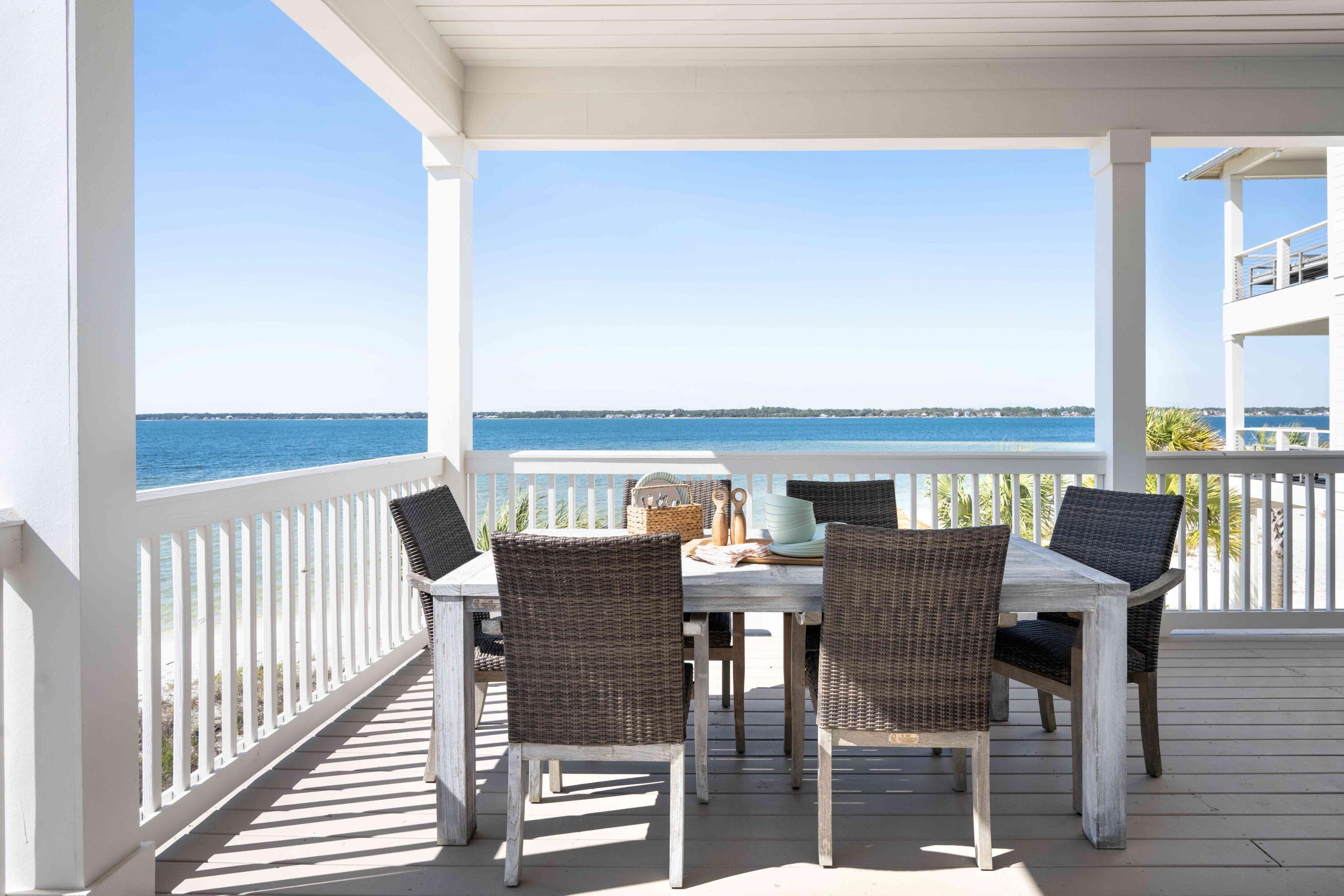1466 Seaside Circle Navarre, FL 32566 - Photo 29 of 69 a view of a dining room with furniture and wooden floor