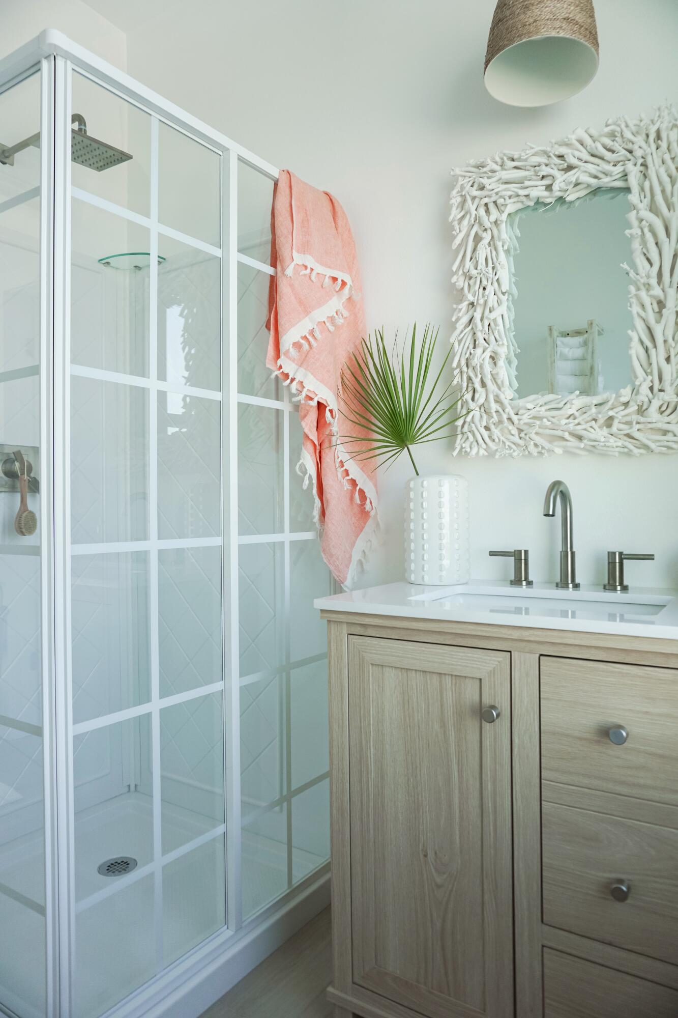 1466 Seaside Circle Navarre, FL 32566 - Photo 38 of 69 a bathroom with a sink a mirror and a potted plant