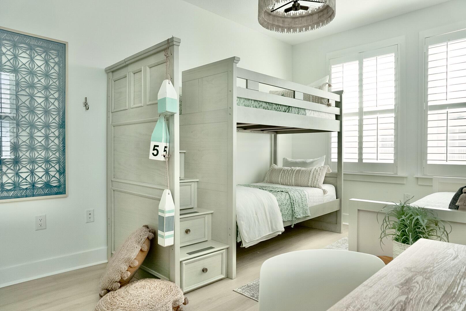 1466 Seaside Circle Navarre, FL 32566 - Photo 40 of 69 a bedroom with a bed and a window with couch