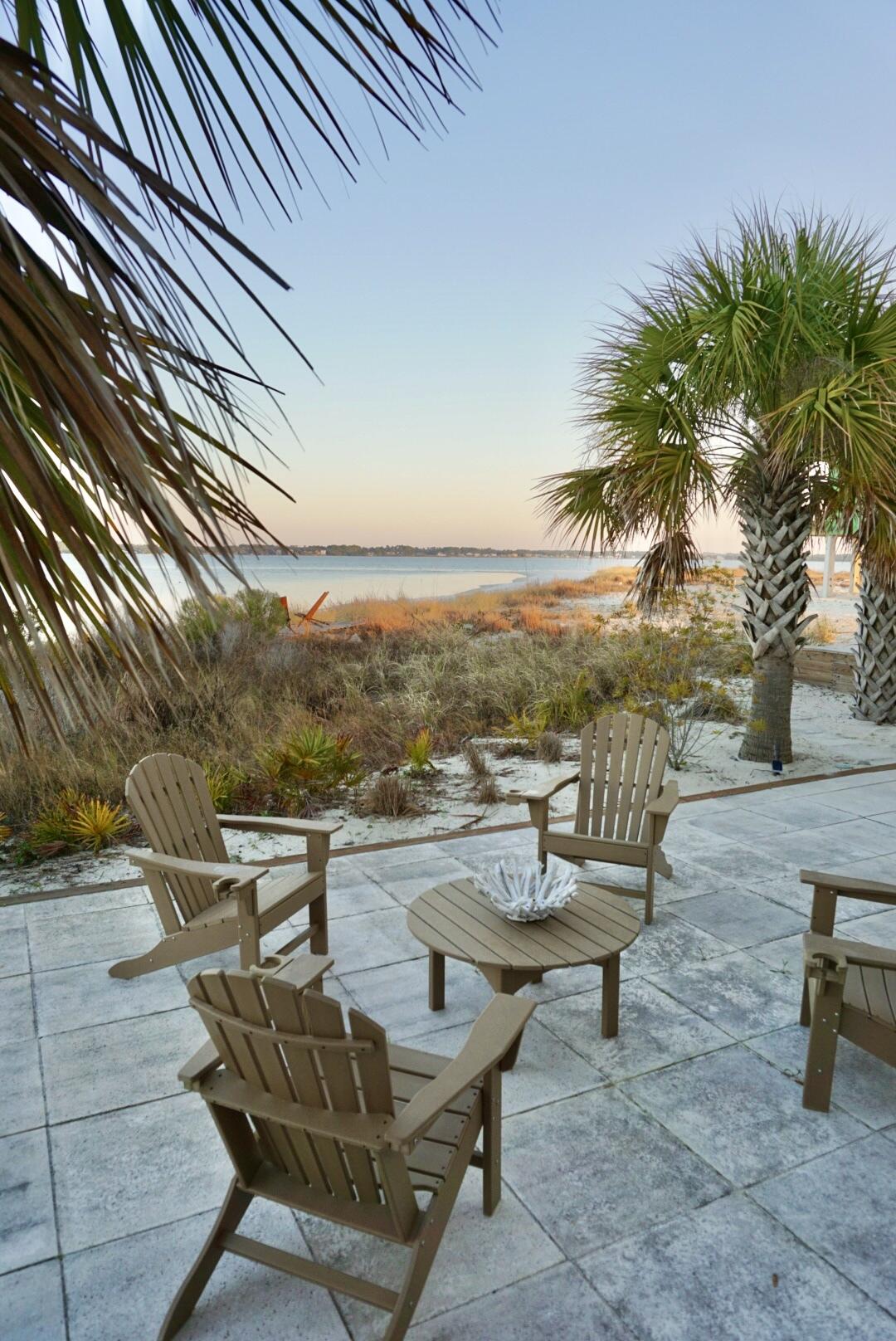 1466 Seaside Circle Navarre, FL 32566 - Photo 58 of 69 a view of a terrace with seating area