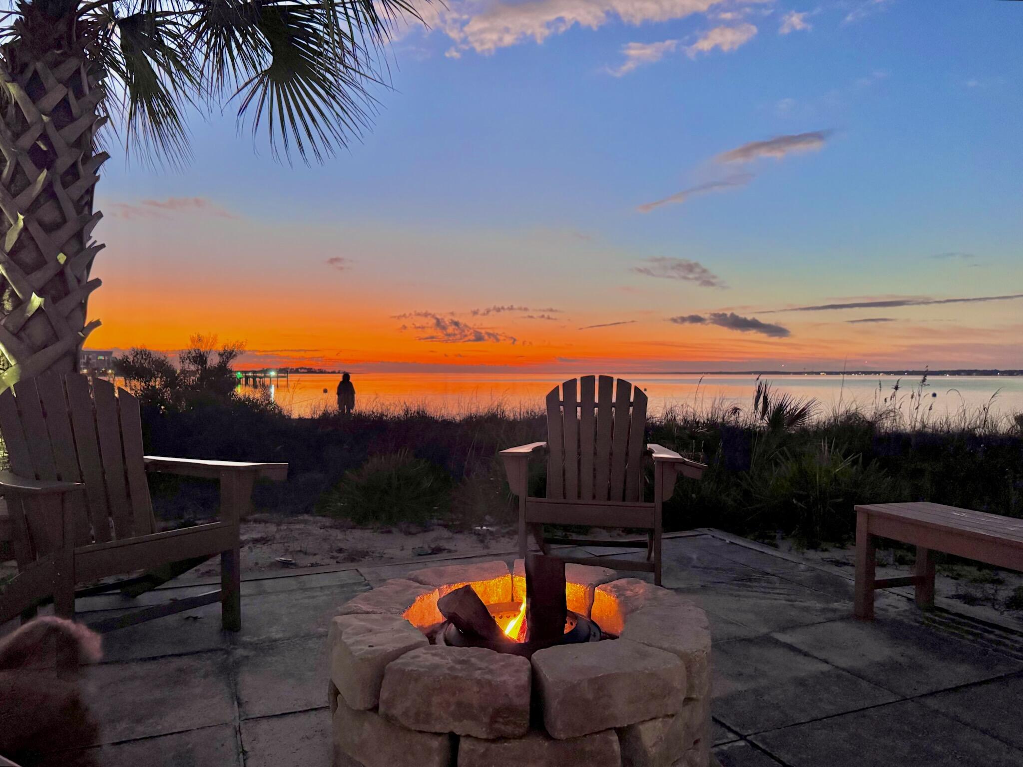 1466 Seaside Circle Navarre, FL 32566 - Photo 67 of 69 a view of a swimming pool with a patio and a garden