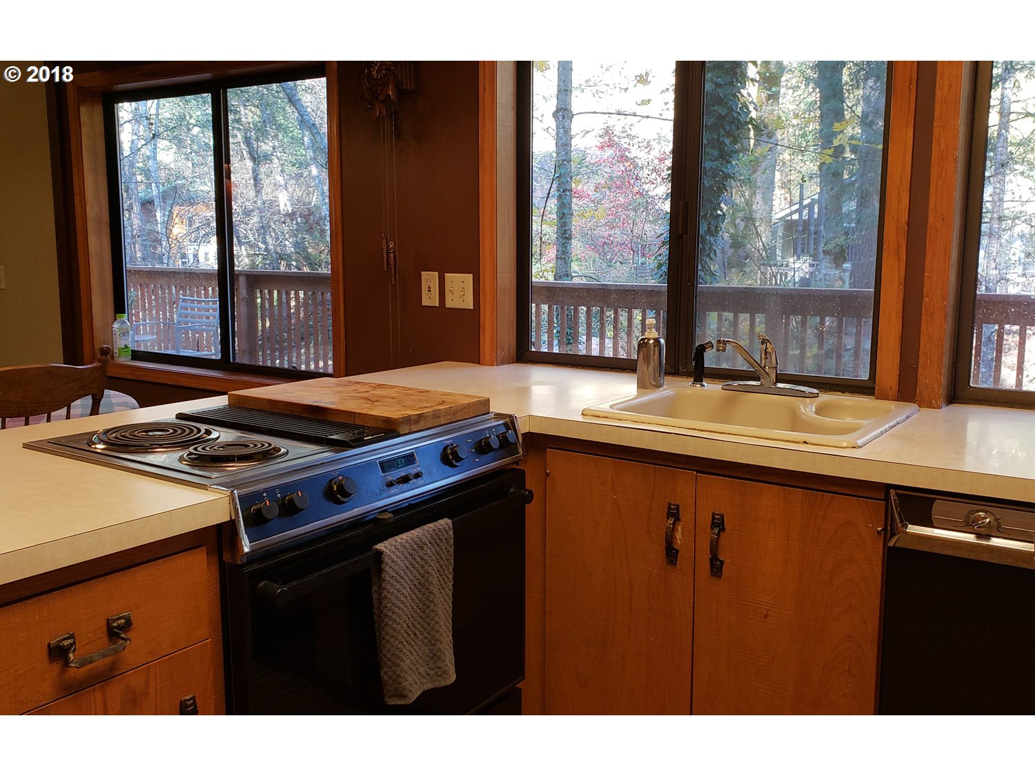 65707 East Barlow Trail Road Rhododendron, OR 97049 - Photo 14 of 32 a kitchen with a stove and a sink