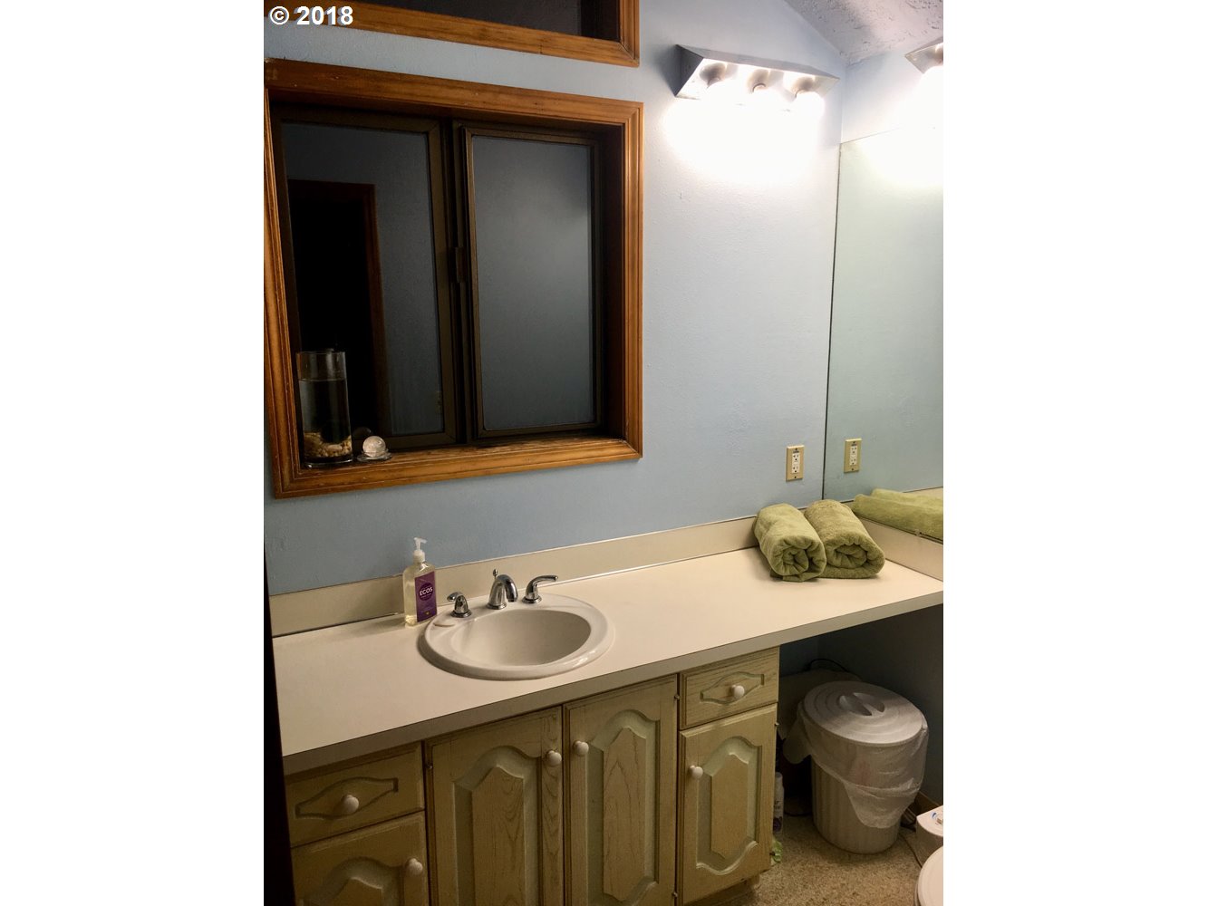 65707 East Barlow Trail Road Rhododendron, OR 97049 - Photo 19 of 32 a bathroom with a sink and a mirror