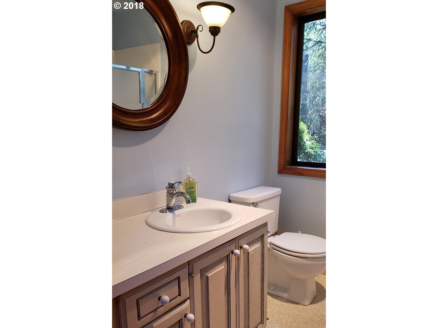65707 East Barlow Trail Road Rhododendron, OR 97049 - Photo 22 of 32 a bathroom with a sink a toilet and a mirror