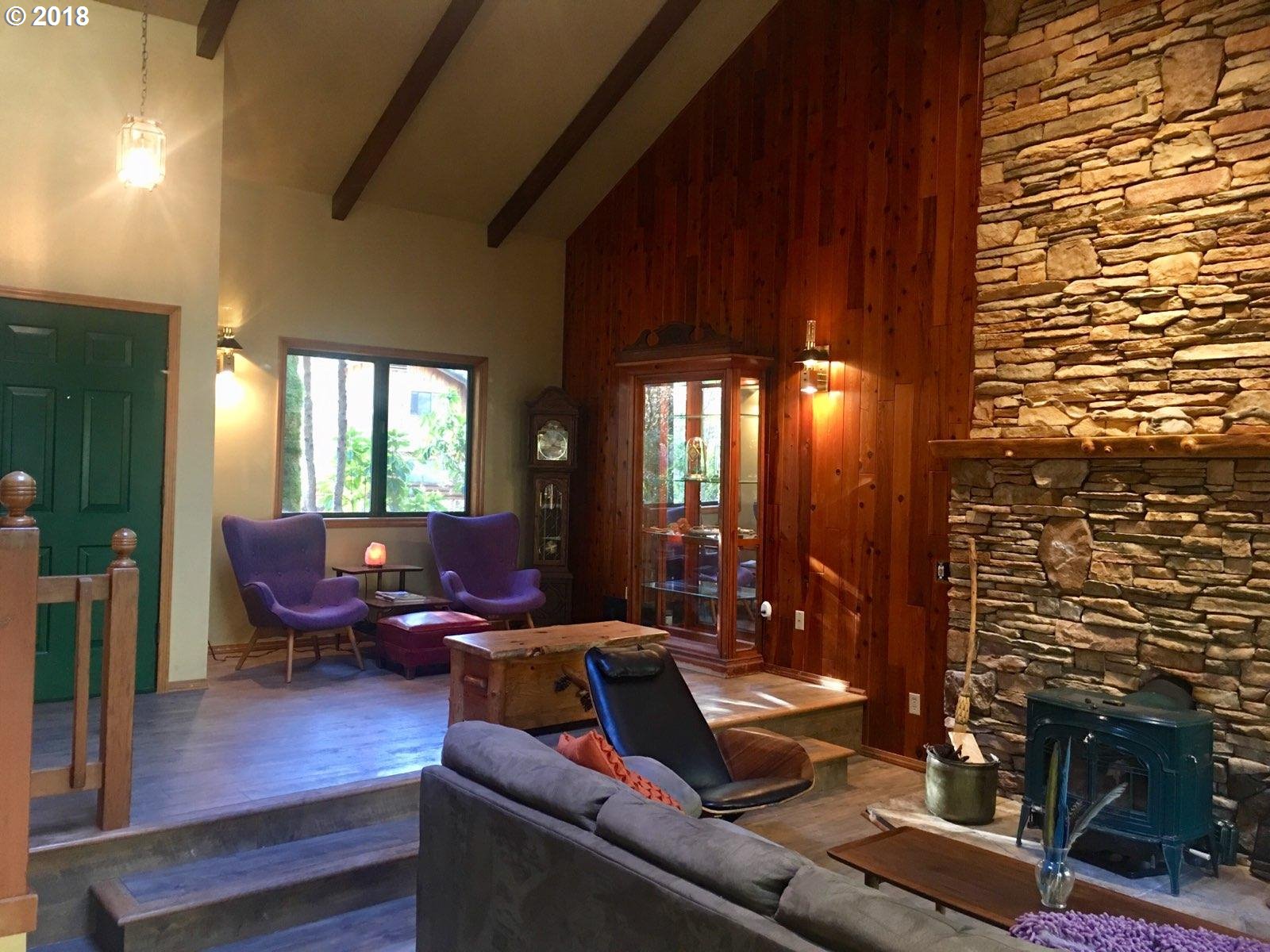 65707 East Barlow Trail Road Rhododendron, OR 97049 - Photo 5 of 32 a living room with furniture and a fireplace