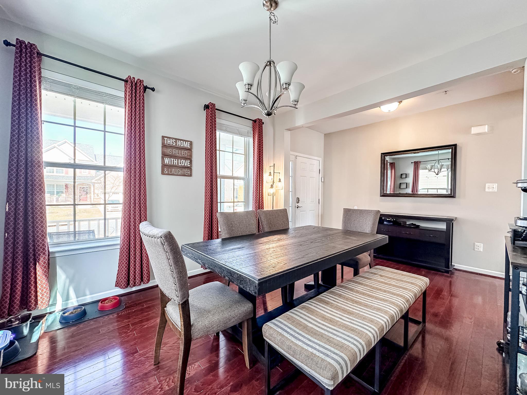 10503 Braddock Run Road Baltimore, MD 21220 - Photo 13 of 64 a view of a dining room with furniture window and wooden floor