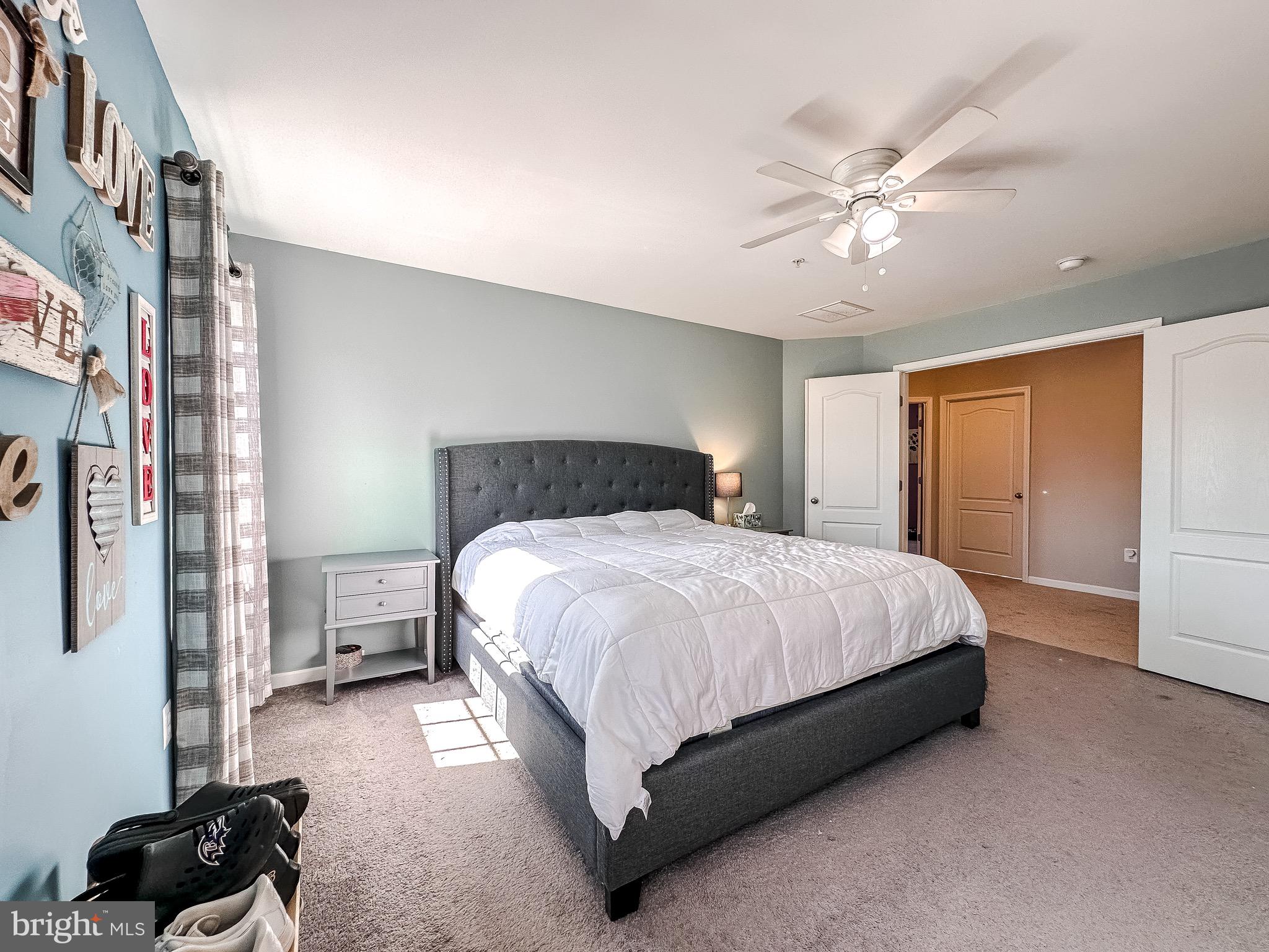 10503 Braddock Run Road Baltimore, MD 21220 - Photo 28 of 64 a bedroom with a bed lamp and a closet
