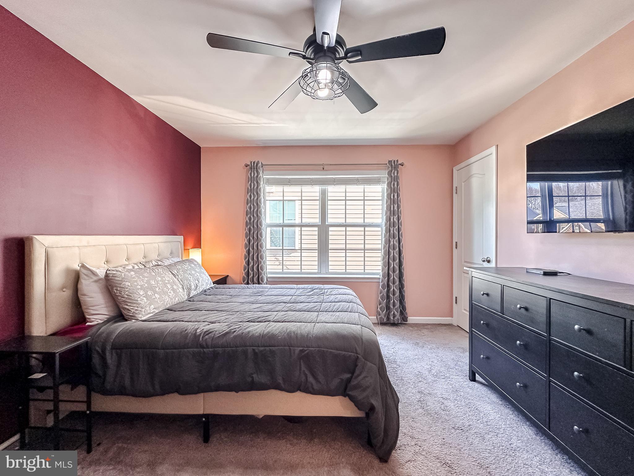 10503 Braddock Run Road Baltimore, MD 21220 - Photo 35 of 64 a bedroom with a bed and a dresser