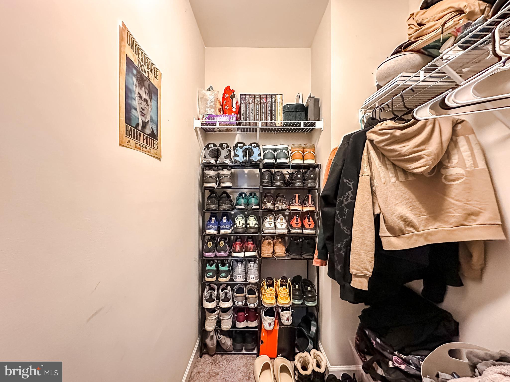 10503 Braddock Run Road Baltimore, MD 21220 - Photo 37 of 64 a view of walk in closet with clothes and shoes