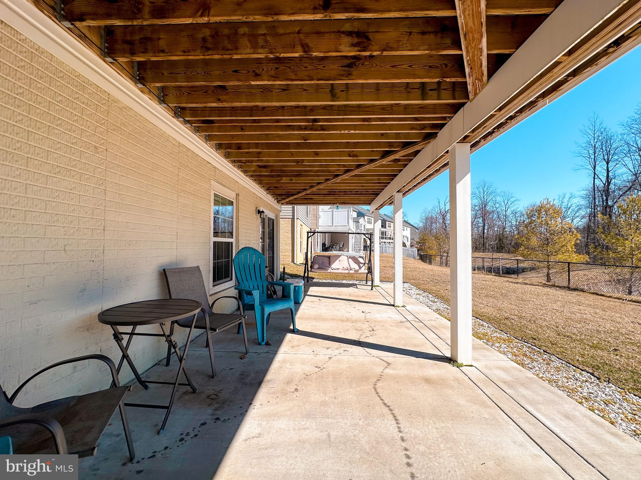 10503 Braddock Run Road Baltimore, MD 21220 - Photo 56 of 64 a view of a porch with furniture and a yard