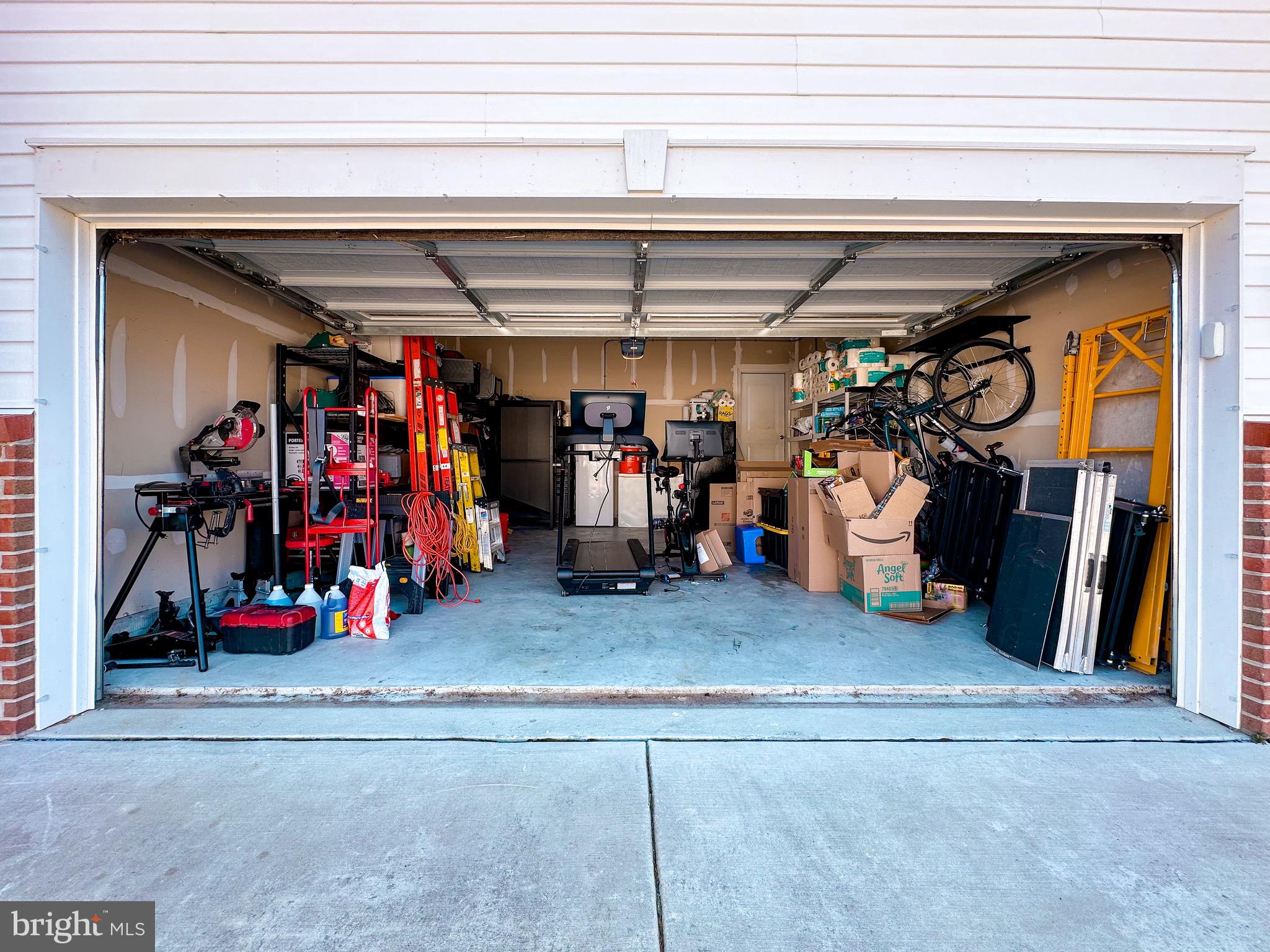 10503 Braddock Run Road Baltimore, MD 21220 - Photo 59 of 64 a view of a storage room with a refrigerator and a group of people