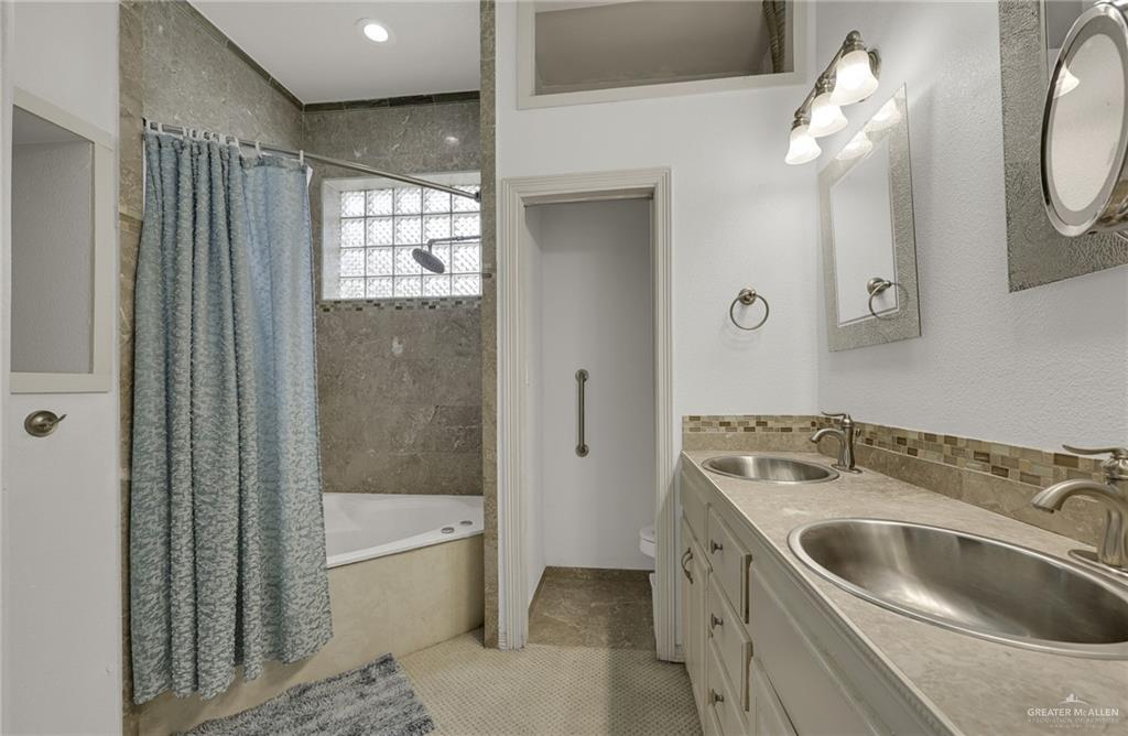 1107 Harbor Lane La Joya, TX 78560 - Photo 13 of 29 a bathroom with a sink a toilet and bathtub