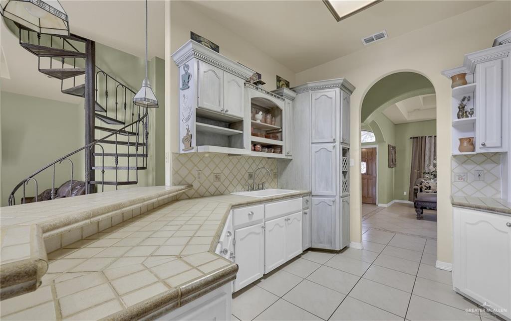 1107 Harbor Lane La Joya, TX 78560 - Photo 6 of 29 a spacious bathroom with a shower a mirror and a sink